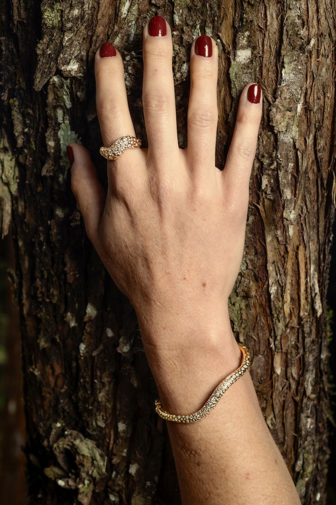 Model wearing Fungi Planet jewelry